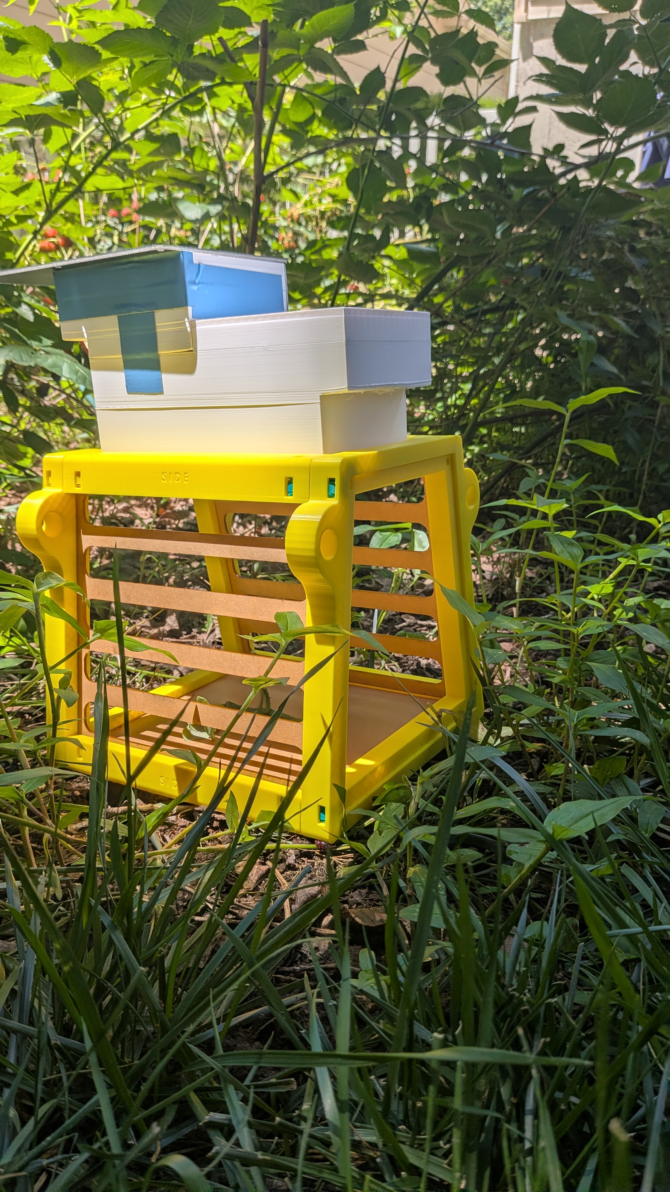FarmVates solar-powered unit in tomato garden.